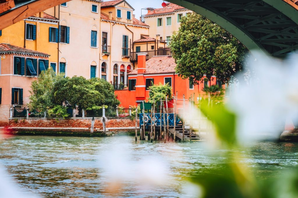 Old ancient facades of houses on Grand Canal, Venice, Italy. Vintage historical architecture